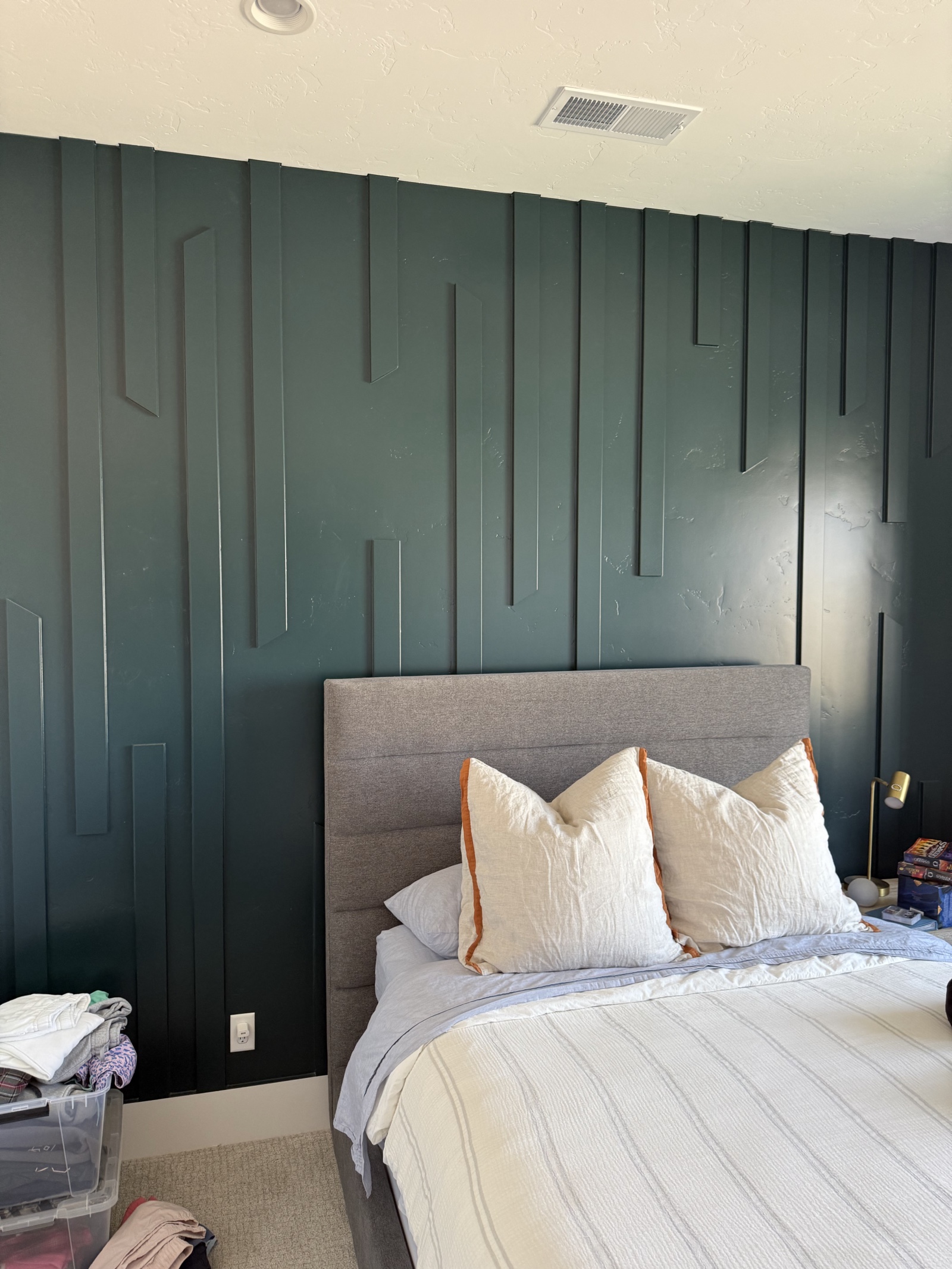 Bedroom with green board-and-batten accent wall