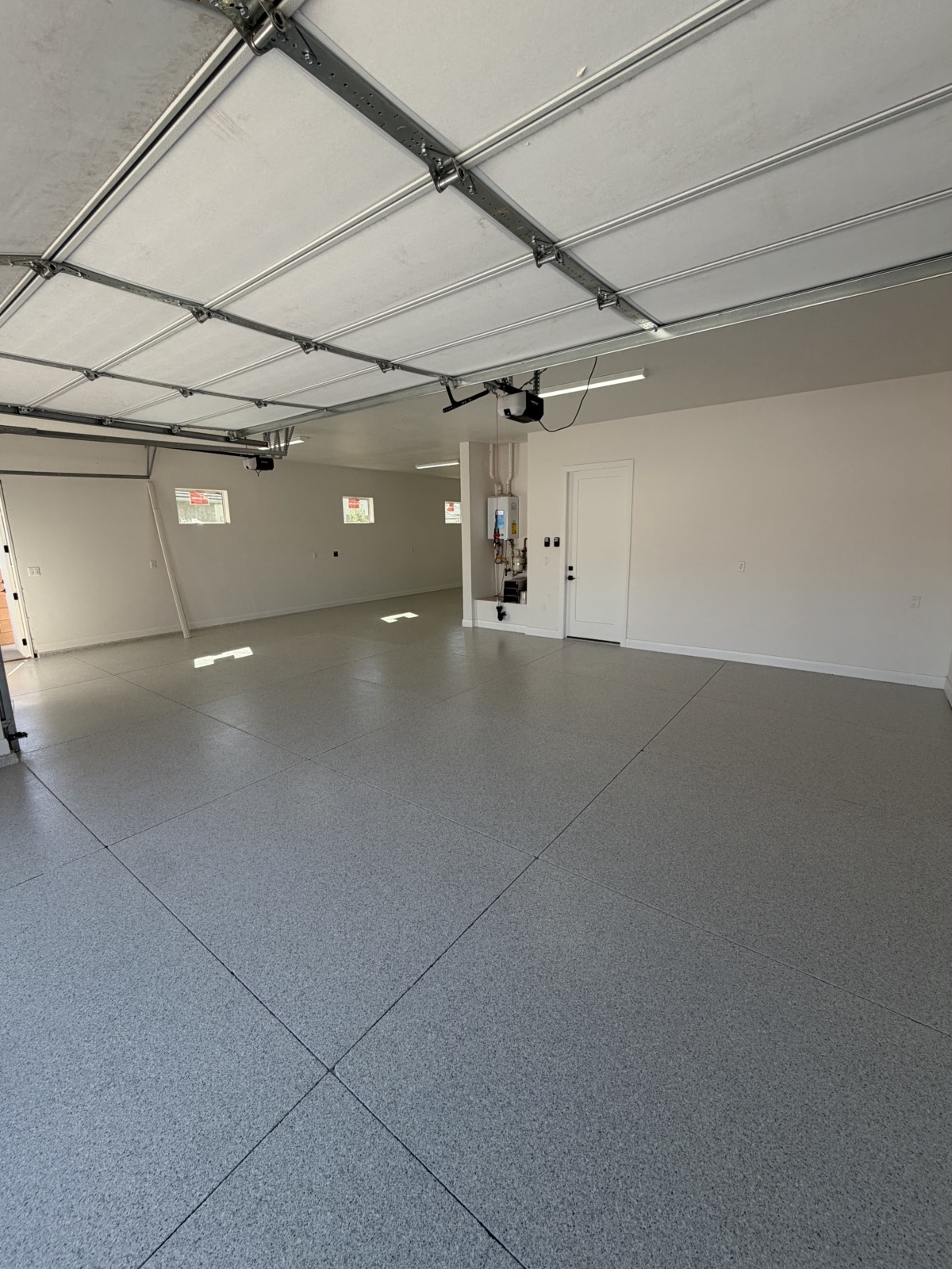 Finished garage floor — gray flake epoxy coating